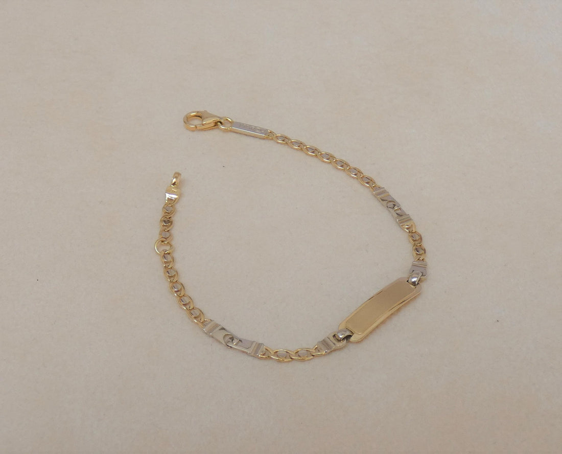 BRACCIALE UOMO IN ORO BICOLORE CON PIASTRINA